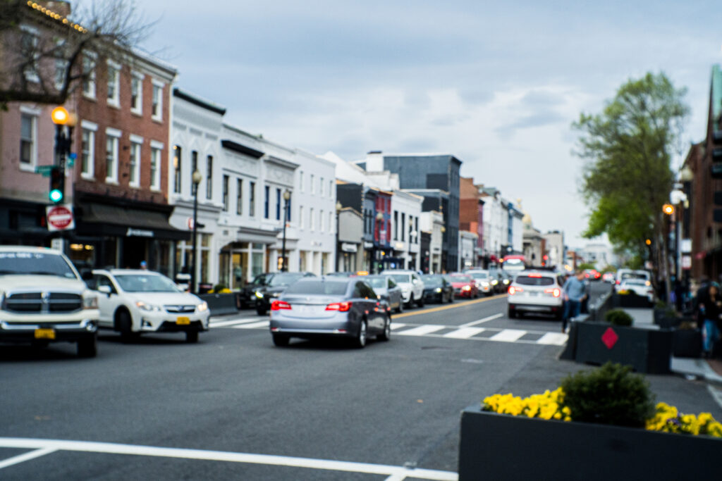 Cars rush in Georgetown and clog the streets. 