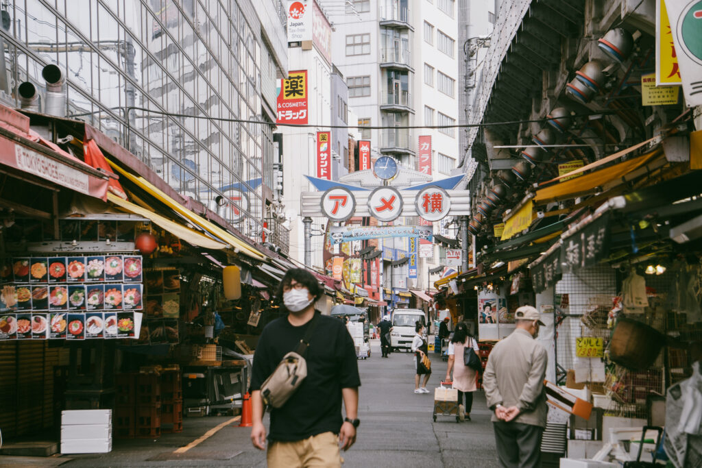A man walks down the Ameyoko Shopping Street in Tokyo.