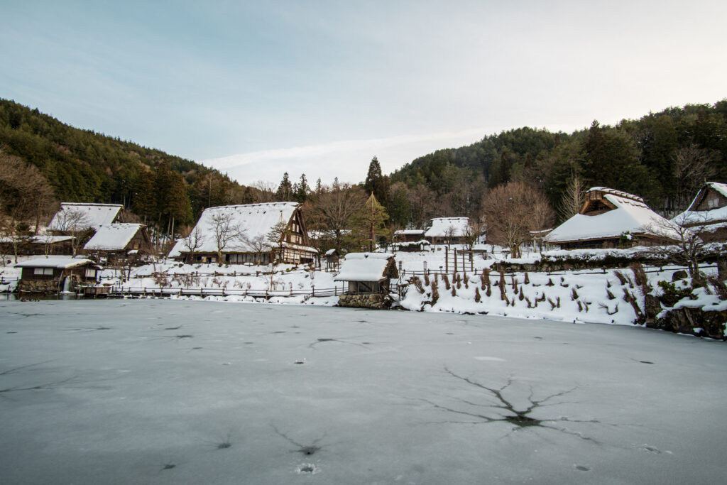 Snow covers houses in the Hida Folk Village in Takayama, Japan.