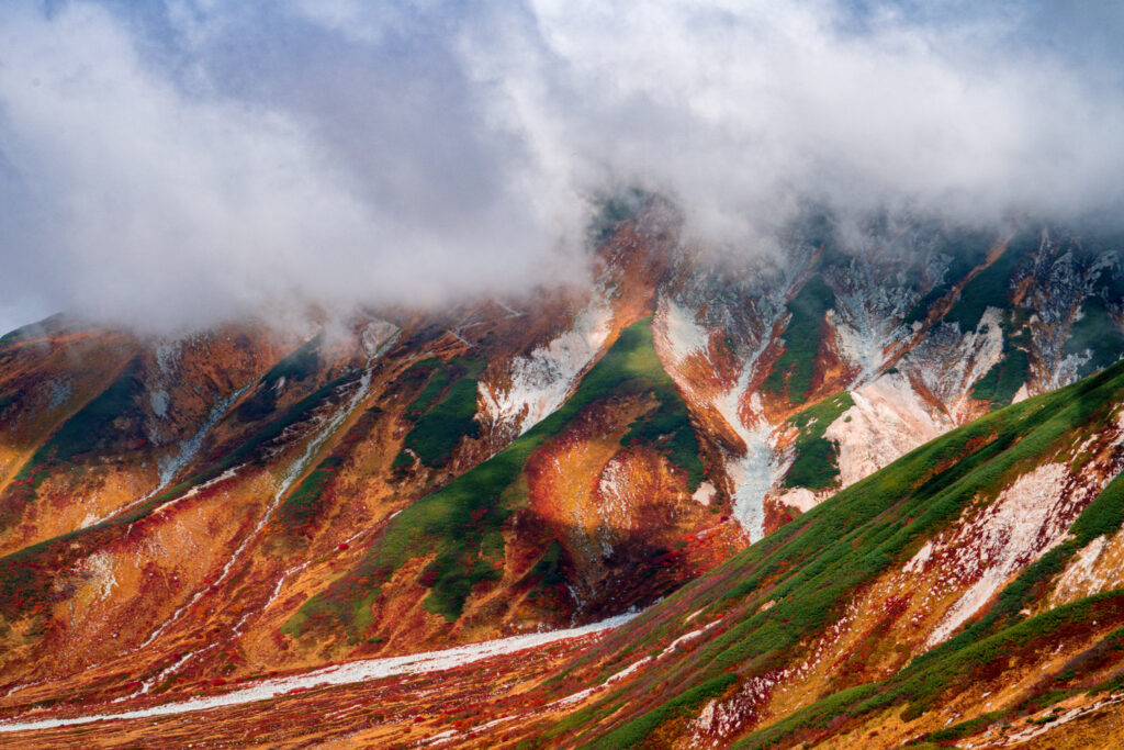 Cloud cover Mt. Tateyama in Japan during autumn