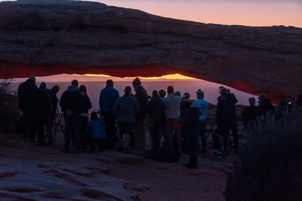 Photographers gather at the Mesa Arch for sunrise in Canyonlands National Park. 