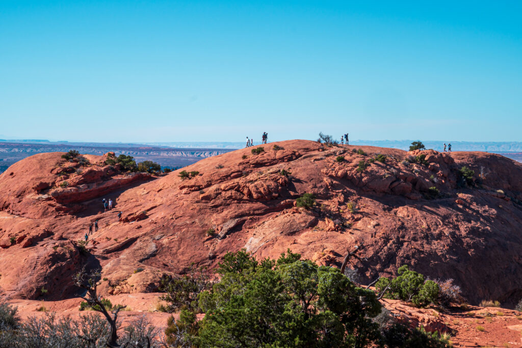 Hikers on the Upheaval Dome Trail in Canyonlands. 