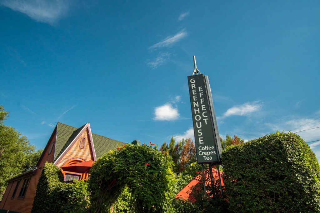 A photo of the outside entrance to Greenhouse Effect Coffee in Millcreek, Utah. 