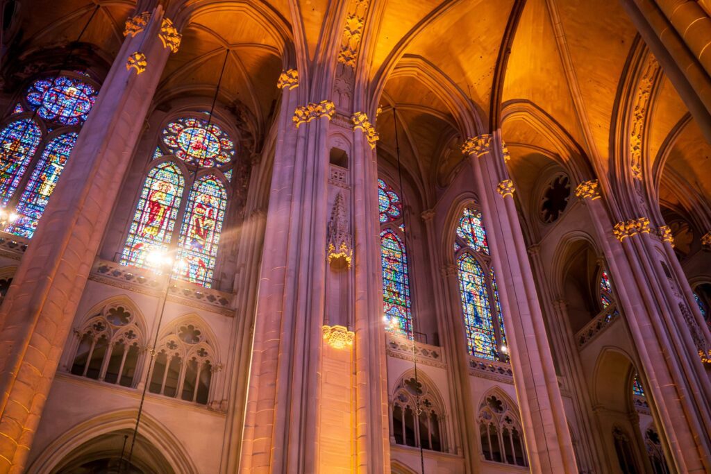 Light reflects off the stained glass in St. John the Divine Cathedral.