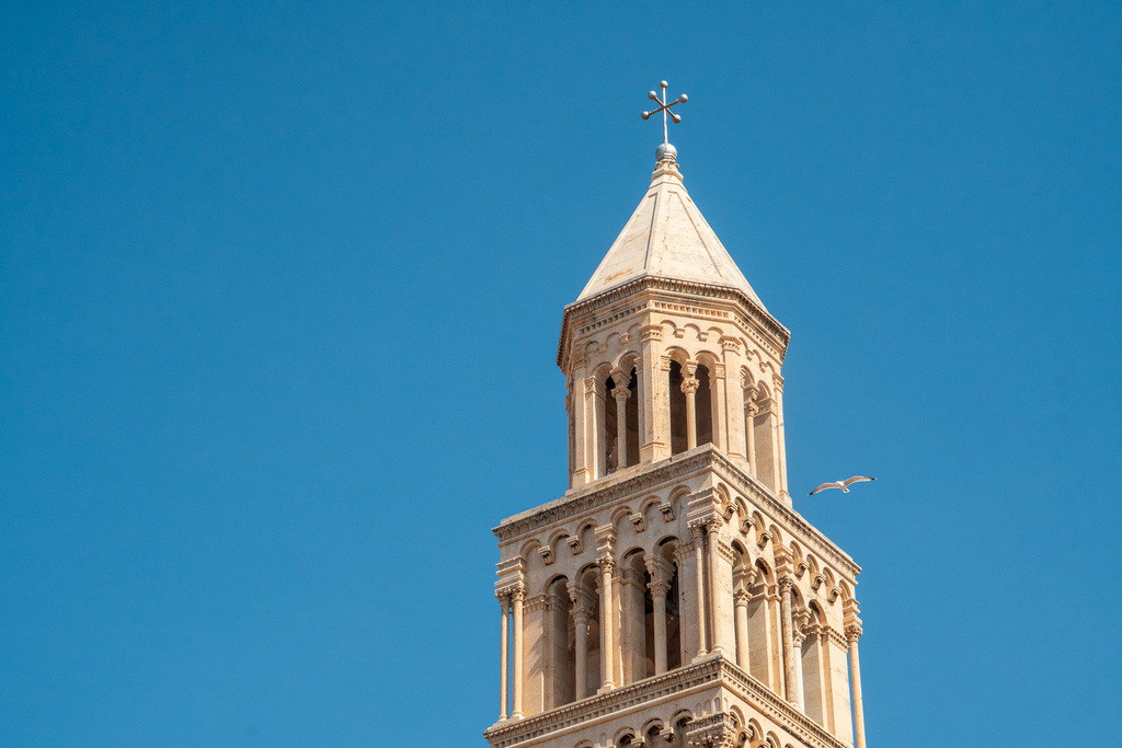 A bird flies past a the tower of Diocletian's Palace in Split, Croatia. 
