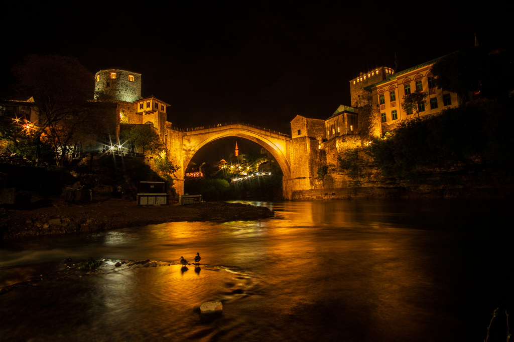 The Stari Most Bridge lights up at night in Mostar. 