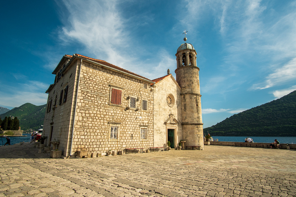 A church is built on a island in the middle of Kotor Bay. This spot is a must visit for your one-month Balkans itinerary. 