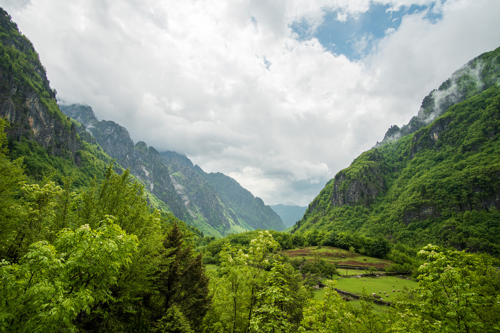 Clouds pass through a valley in the Albanian Alps. 