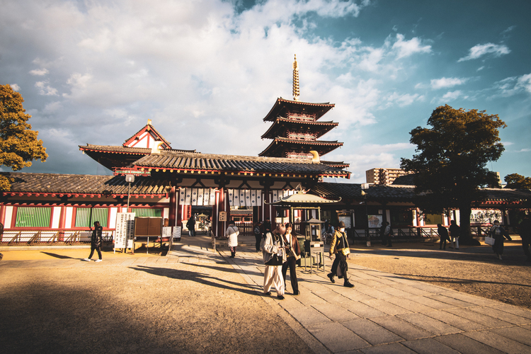 The Shitennoji temple in Osaka with people walking the grounds