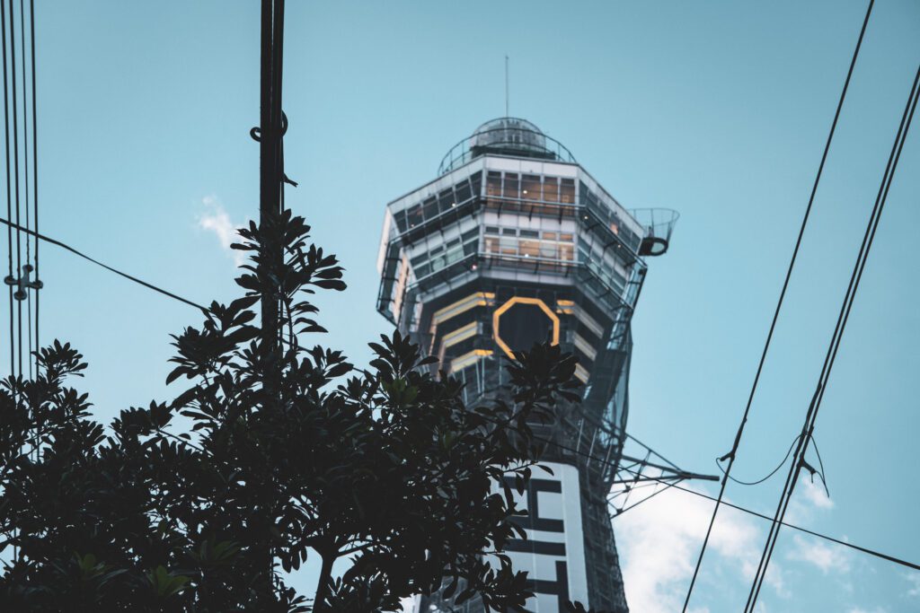 A view from the street looking up to the Tsutenkaku Tower