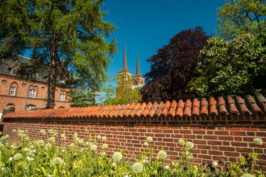 Flower bloom infront of the Roskilde Cathedral. This is a great day trip from Copenhagen to do during your solo trip.